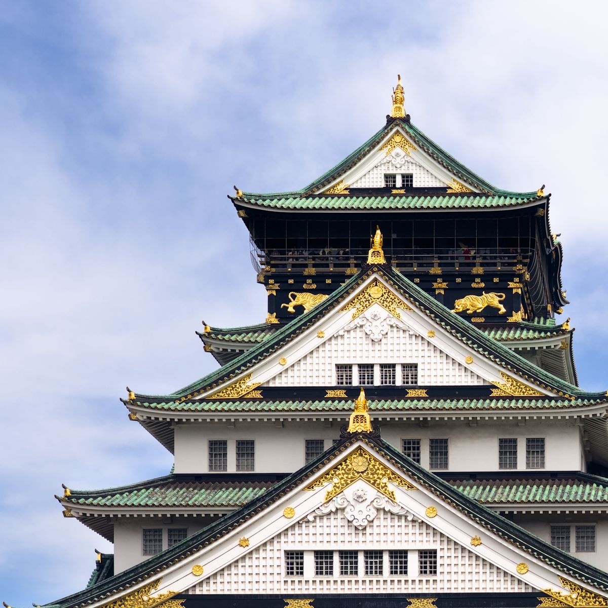 Osaka Castle against a bright blue sky