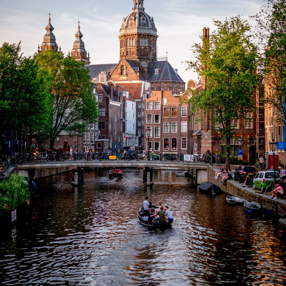 Classic canal houses lining an Amsterdam canal